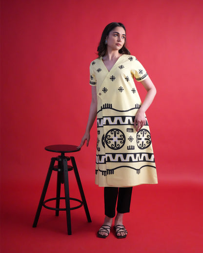 Model wearing the Kiiro Cotton Kurta Co-ord Set, showcasing the pastel yellow tribal wrap kurta with contrasting black pants
