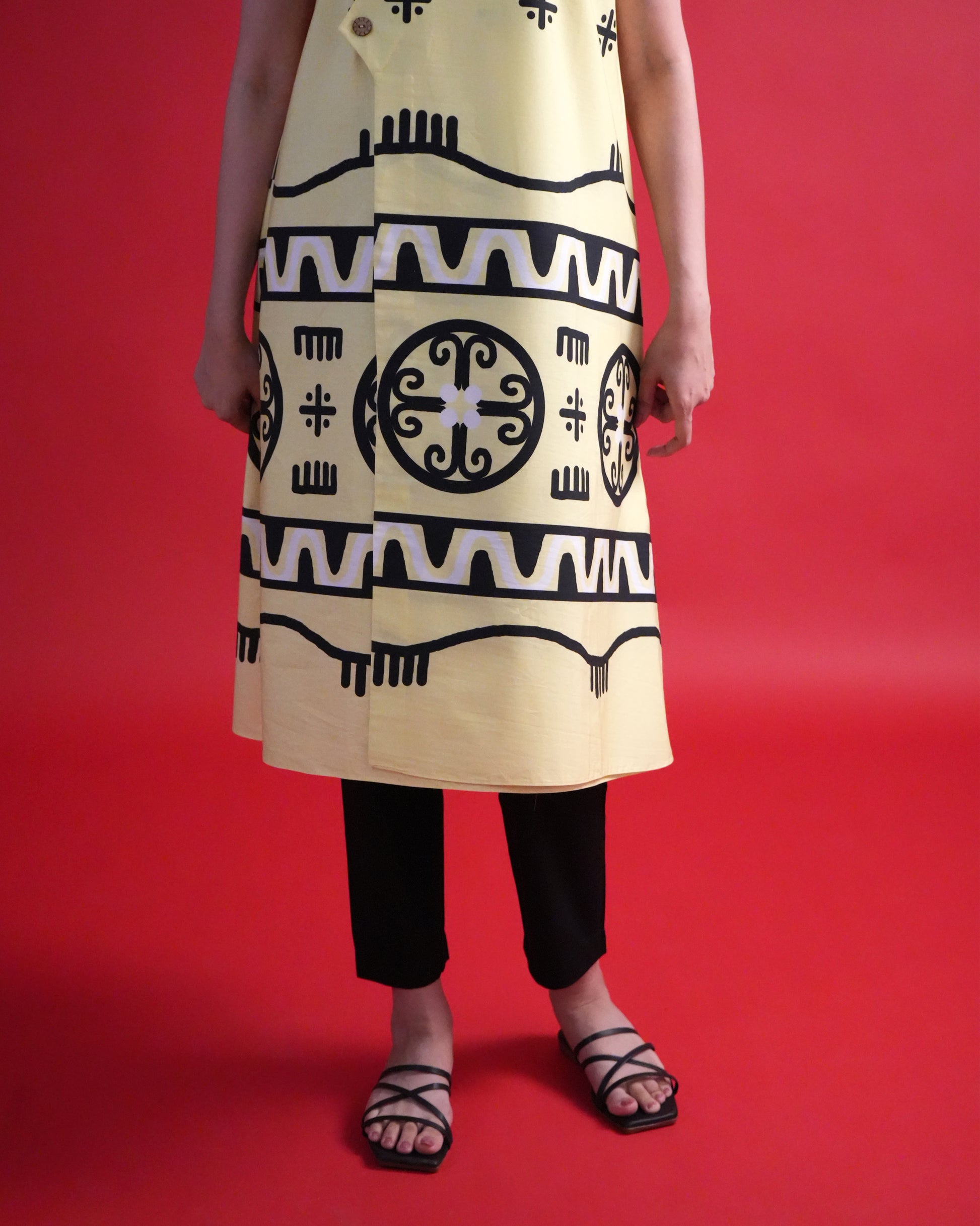 Close-up of the tribal print details on the pastel lemon yellow cotton wrap kurta from the Kiiro Co-ord Set