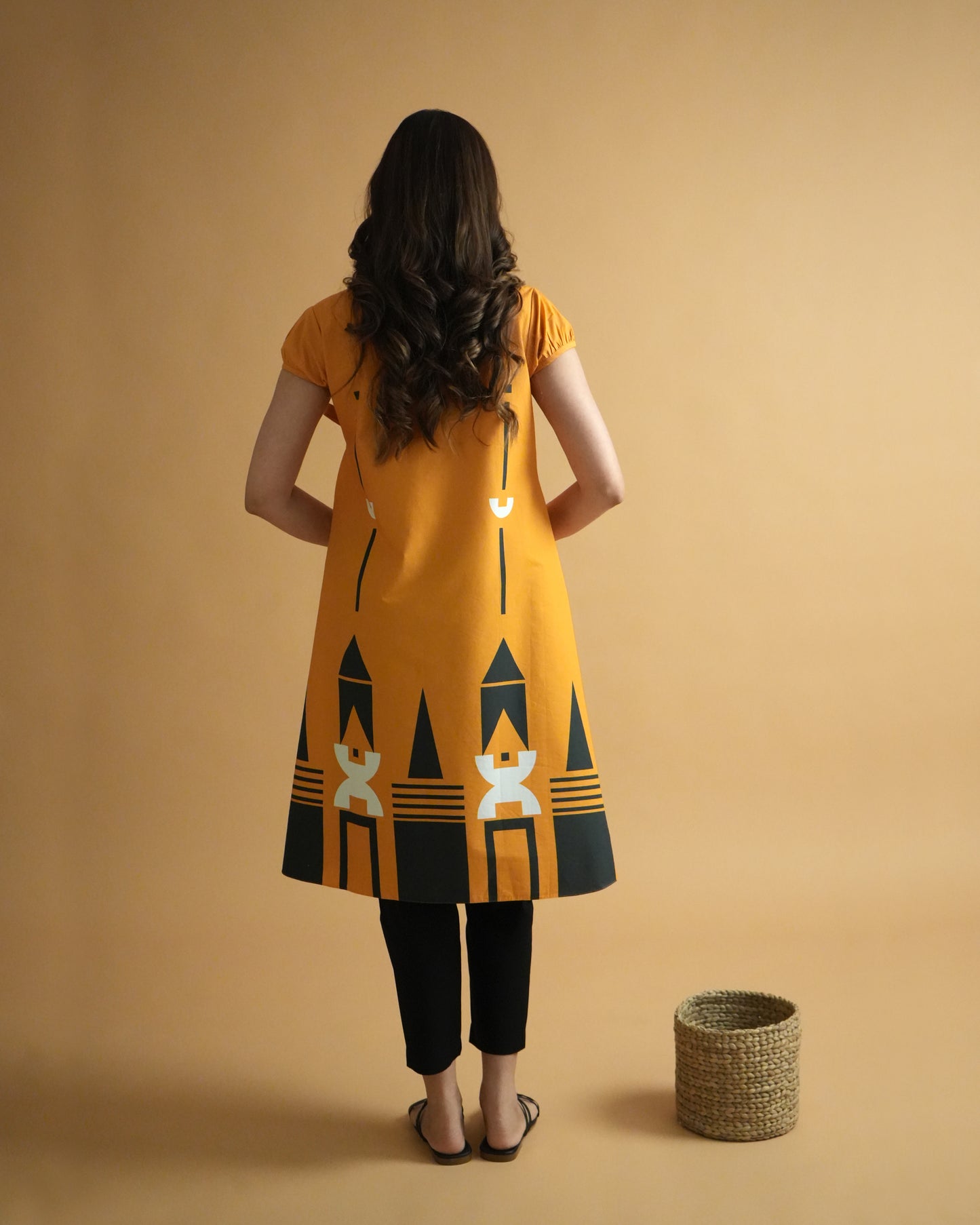 Back view of Kara Cotton Kurta Co-ord Set in orange showing wrap-style kurta and straight pants