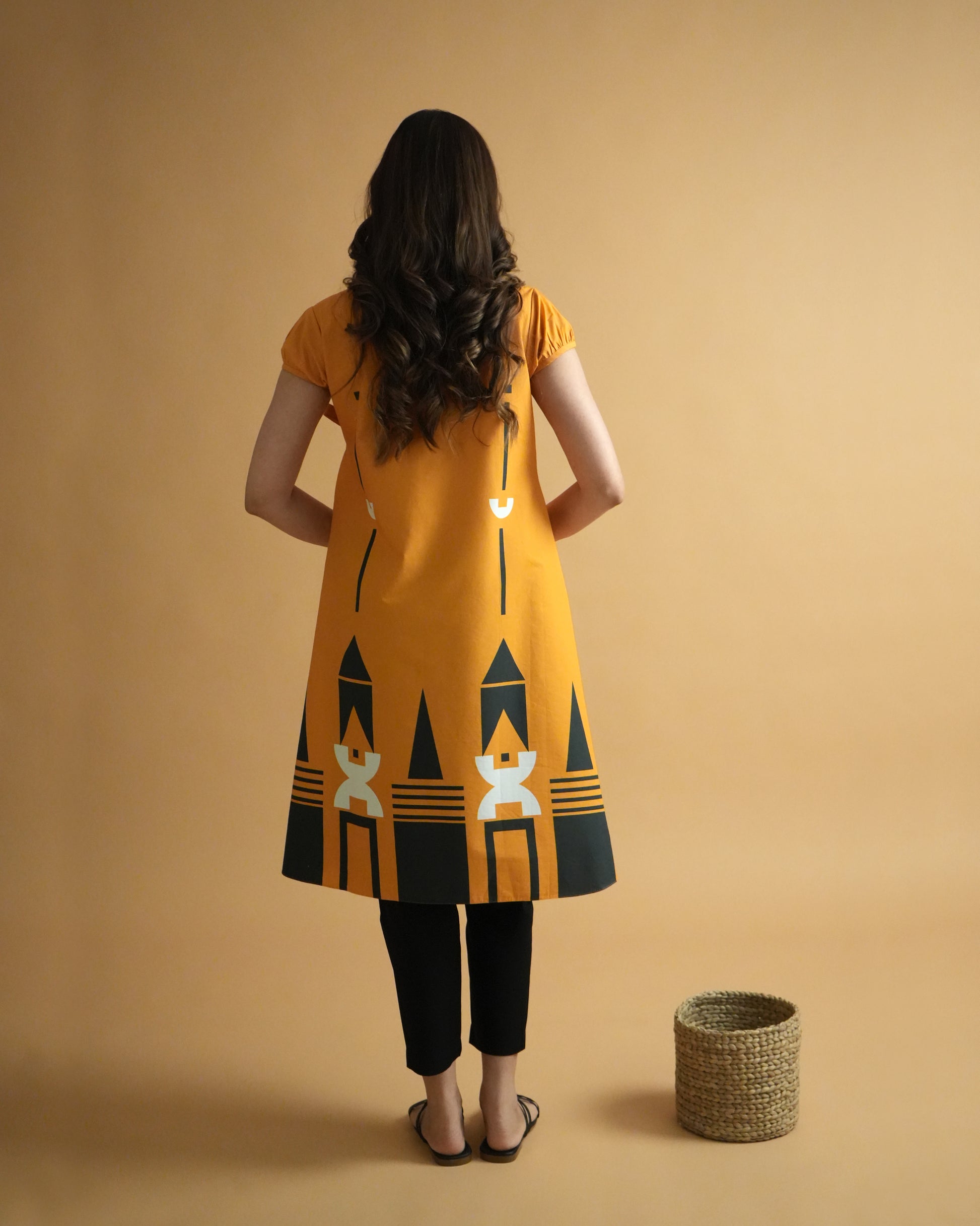 Back view of Kara Cotton Kurta Co-ord Set in orange showing wrap-style kurta and straight pants