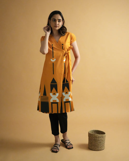 Front view of Kara Cotton Co-ord Set in vibrant orange with wrap kurta, puff sleeves, tribal prints, and straight pants