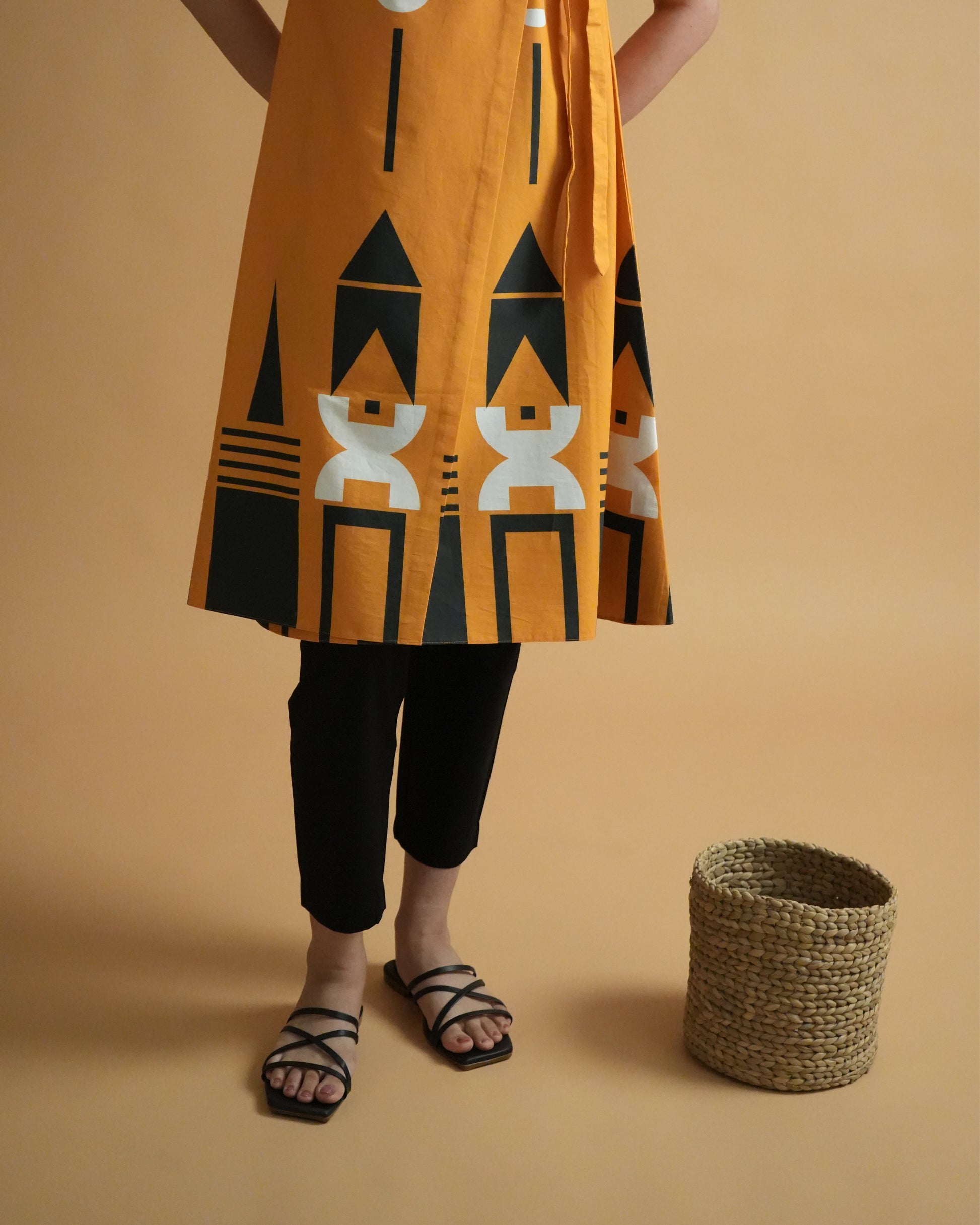 Fabric close-up showing tribal prints on orange cotton from the Kara Cotton Co-ord Set