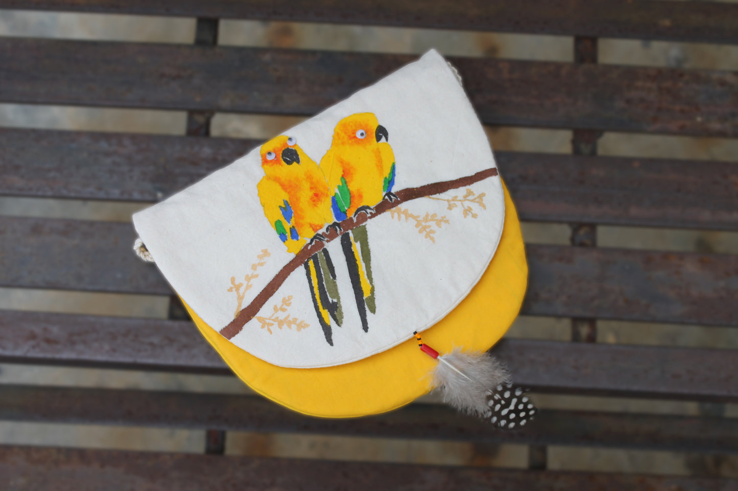 Front flap view of handpainted Sun Conure Sling Bag made from cotton fabric