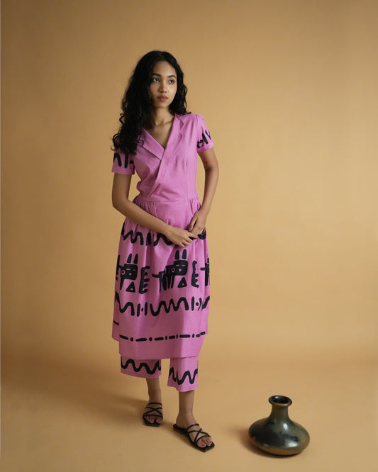 Front view of Jambu Cotton Co-ord Set with pink lapel-collar kurta, cuffed sleeves, tribal motifs, and wide-leg pants