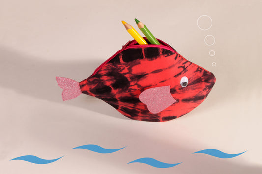 Side view of Pink Pomfret Fish Pouch made from cotton fabric showing stationery organised 