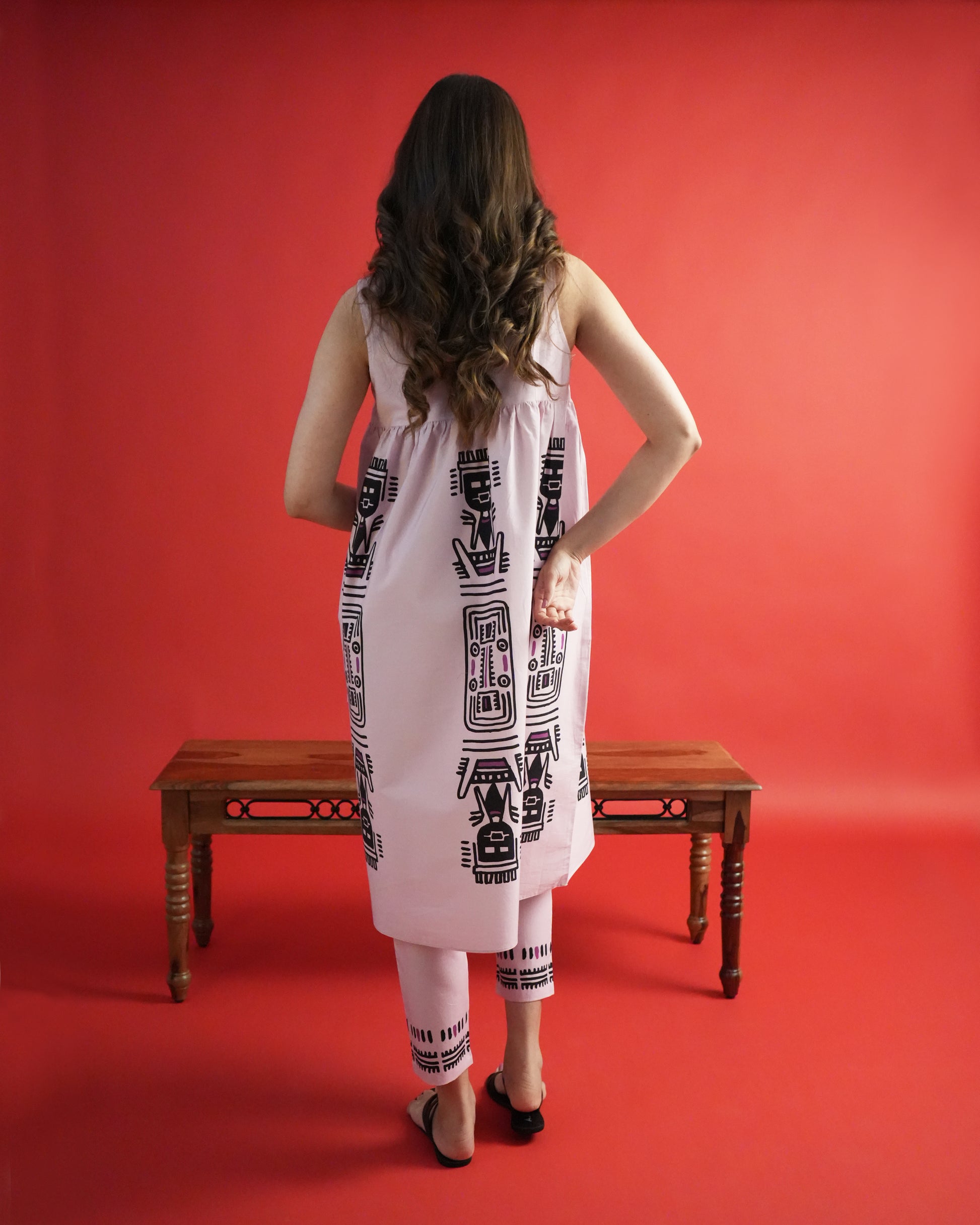 Back view of Merah Cotton Kurta Co-ord Set in powder pink showing sleeveless kurta and slim trousers