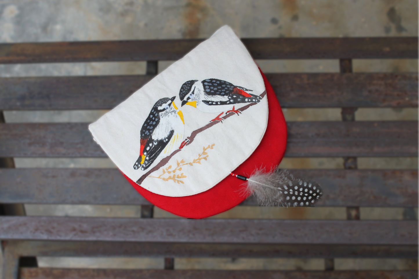 Front flap view of handpainted Spotted Pardalote Sling Bag made from cotton fabric with a feather tassel detail