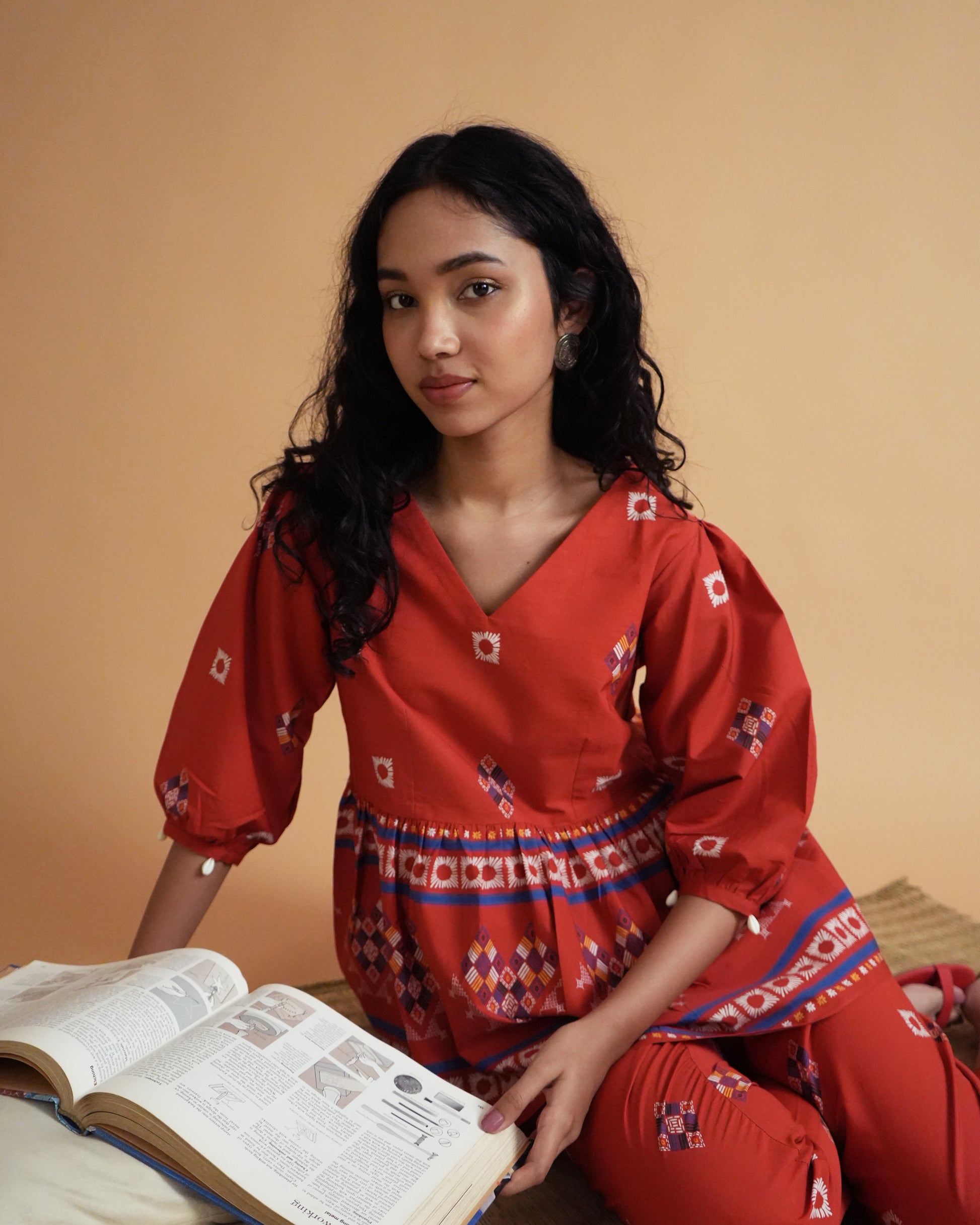 Close-up of gathered waistline design on red kurta from the Ula Cotton Co-ord Set