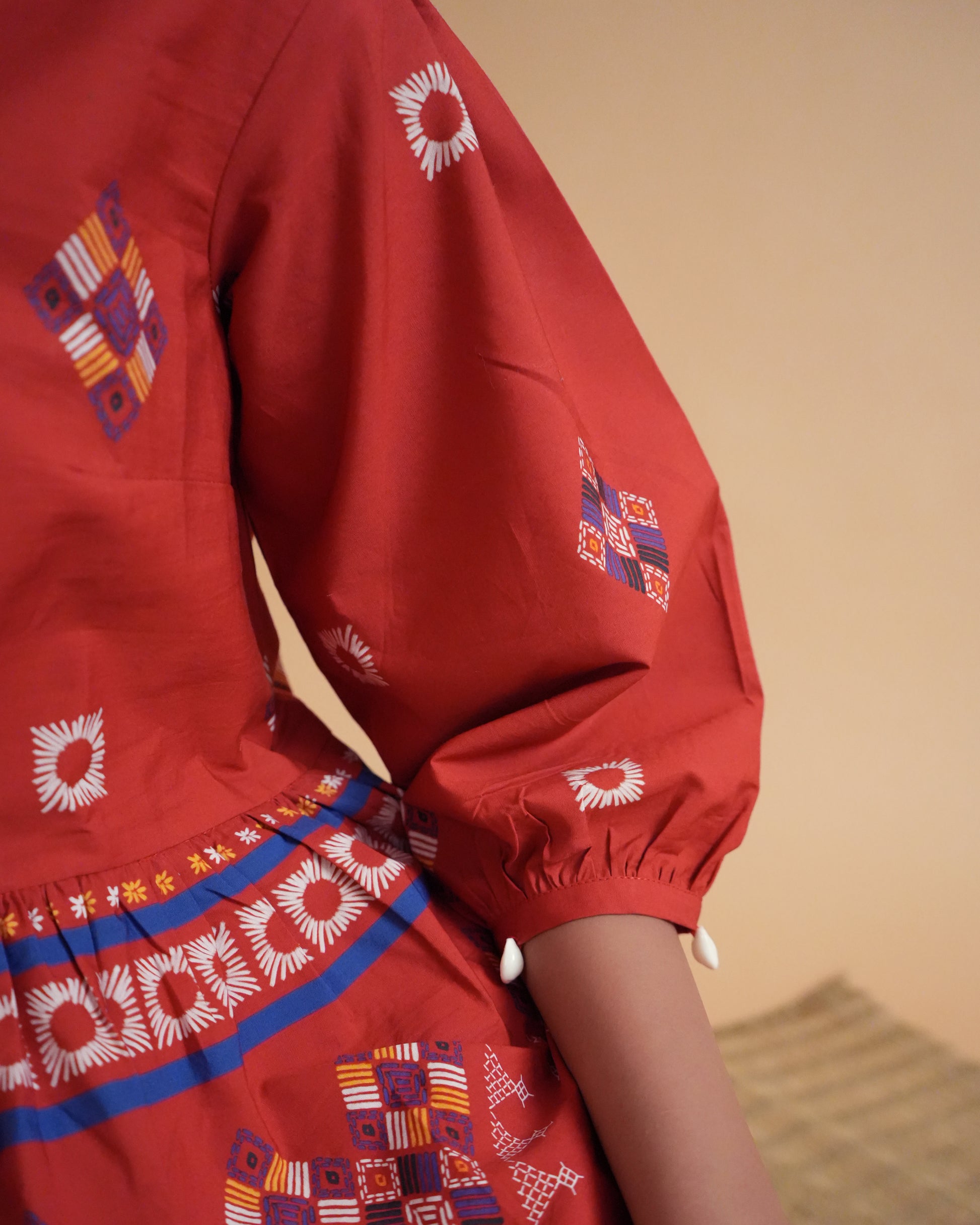 Sleeve close-up of red cotton with artisanal finish from the Ula Cotton Kurta Co-ord Set.