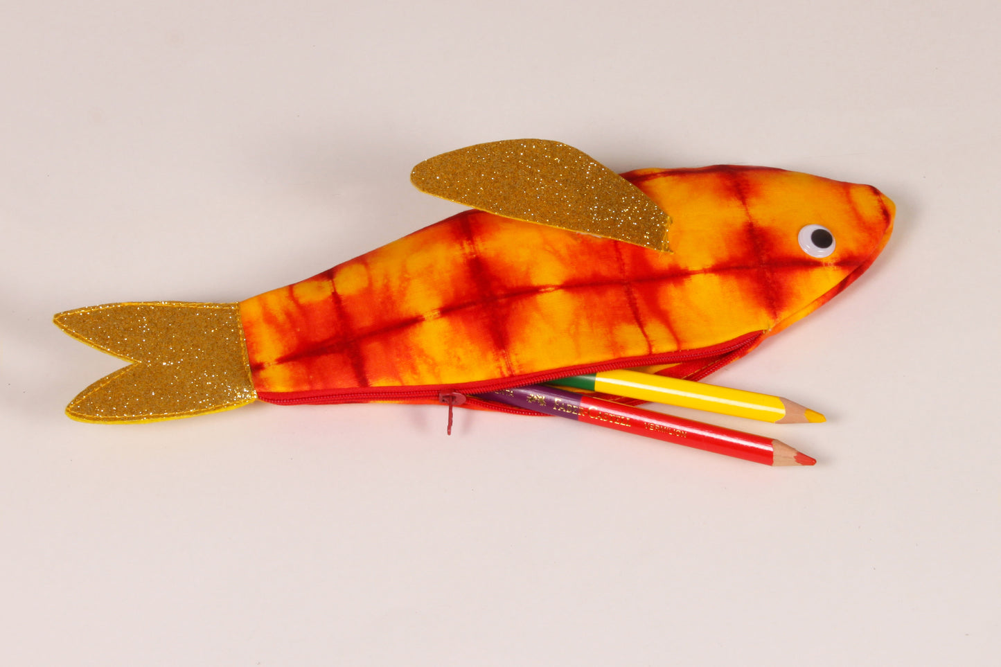 Side view of Golden Yellow Rohu Fish Pouch made from cotton fabric showing stationery organised 