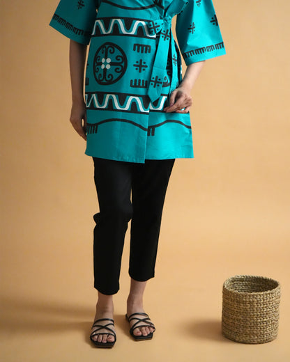 Fabric close-up of turquoise cotton with tribal-inspired wrap detail from the Biru Cotton Co-ord Set