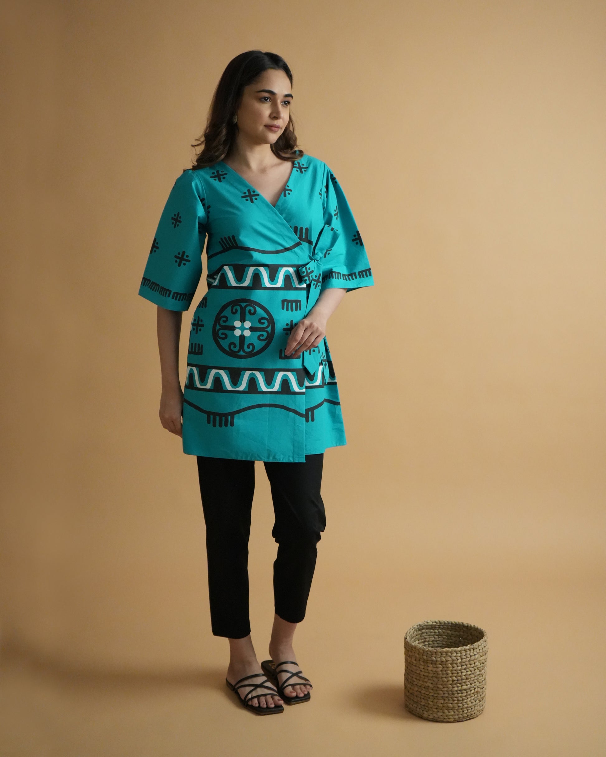 Side view of Biru Cotton Co-ord Set in turquoise with flared sleeves and tie detail