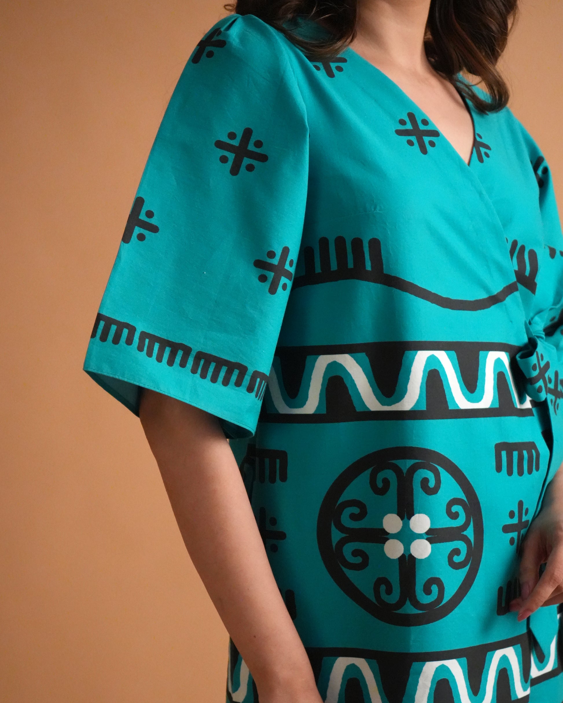 Detailed shot of flared sleeve design in turquoise cotton from the Biru Cotton Kurta Co-ord Set