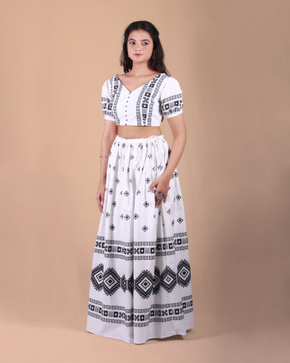 Front view of Ivory Tribal Co-ord Set with a cotton crop top and skirt in tribal print, puff sleeves, and tassel accents