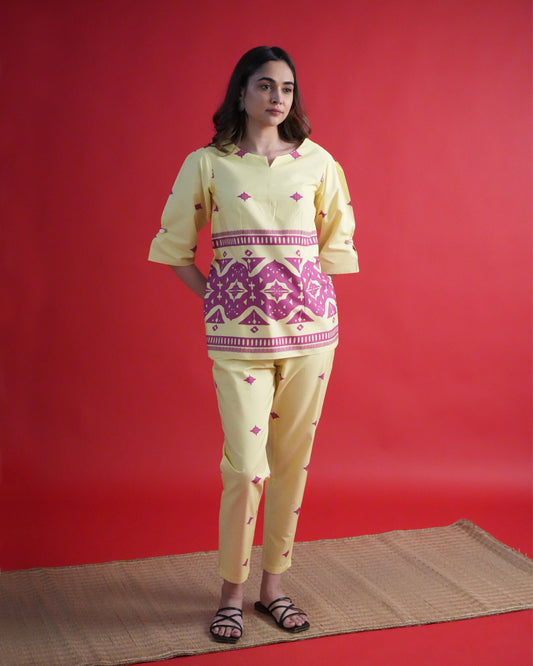 Front view of Yona Cotton Co-ord Set in lemon yellow with shell loop sleeves, tribal prints, and straight-fit pants