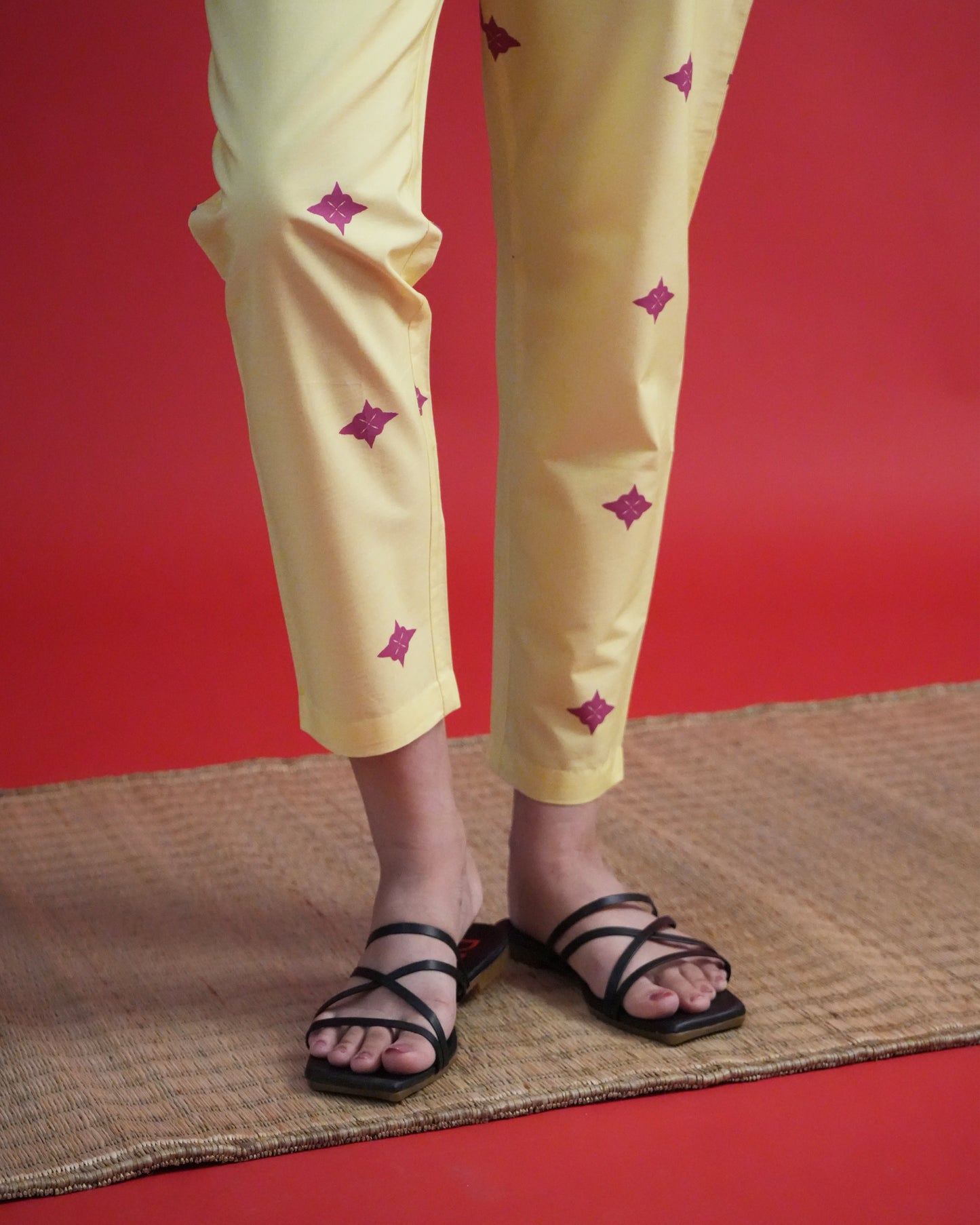 Zoomed-in view of straight-fit pants from the Yona Cotton Kurta Co-ord Set in lemon yellow
