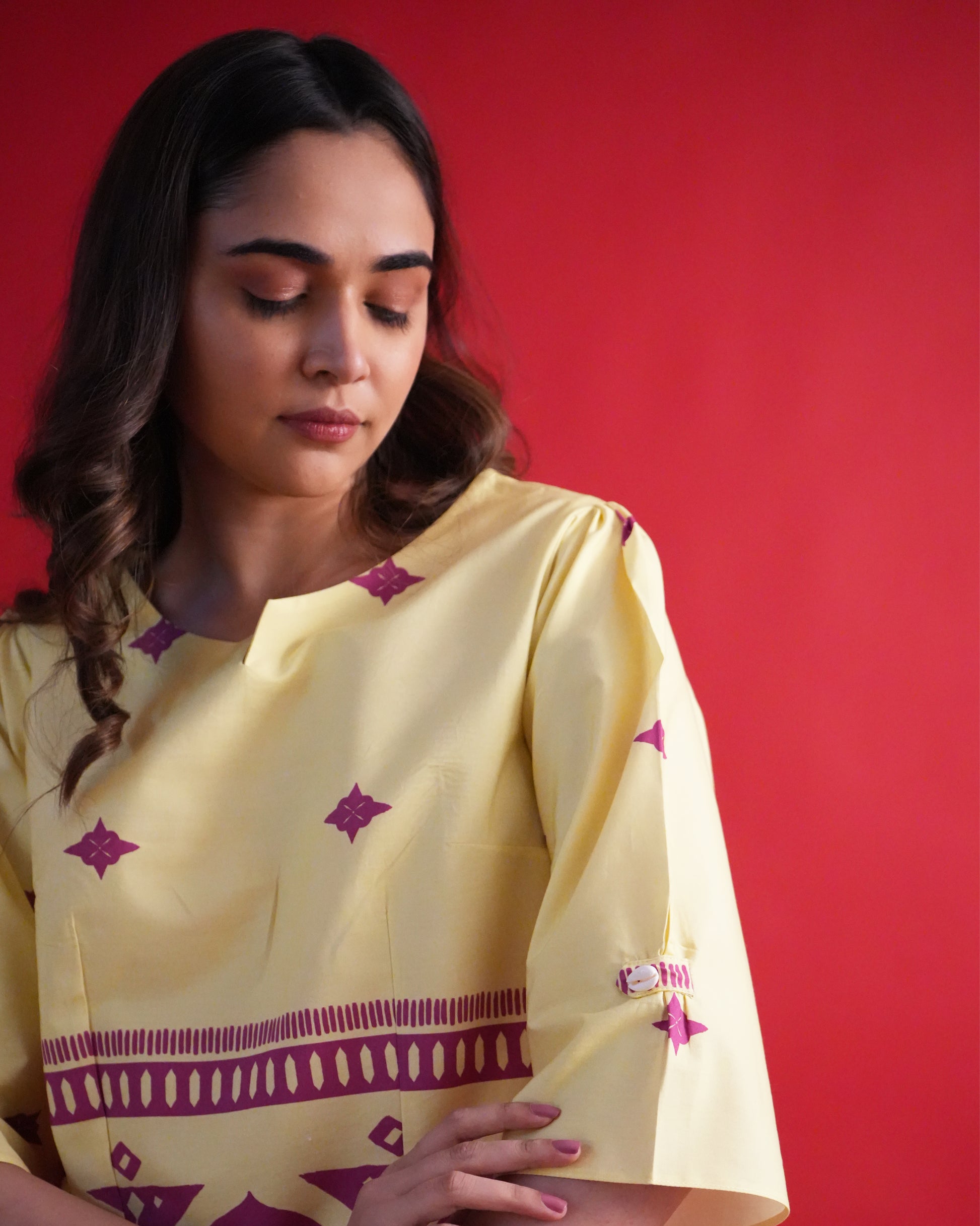 Close-up of shell loop sleeve detail on the lemon yellow kurta from the Yona Cotton Co-ord Set
