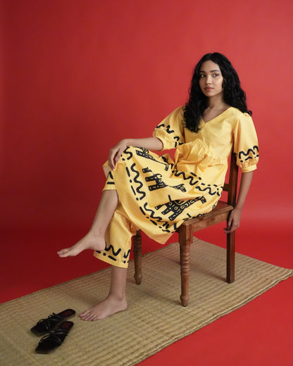 Model wearing Sikwu Cotton Co-ord Set with mango yellow empire-line kurta, puff sleeves, and wide-leg pants